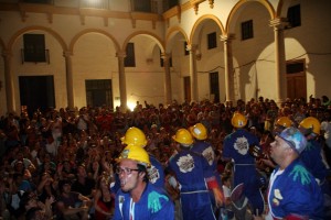 a group of people sitting in front of a crowd