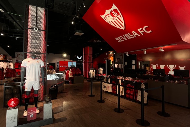 a group of people standing in front of a store